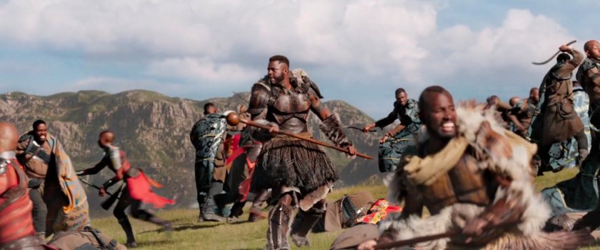 M'baku observes the fighting all around him.