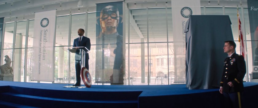 Sam Wilson on stage in front of an audience at the Smithsonian.