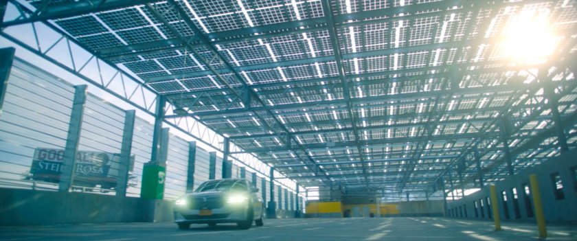 Car in futuristic parking garage.