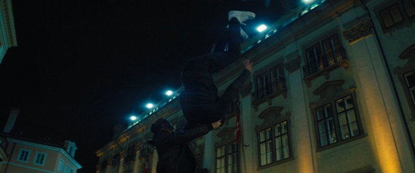 Man flipping another man outside the Gasel Bank in Switzerland.