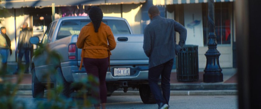 Sam and his sister walk to their car outside the bank.