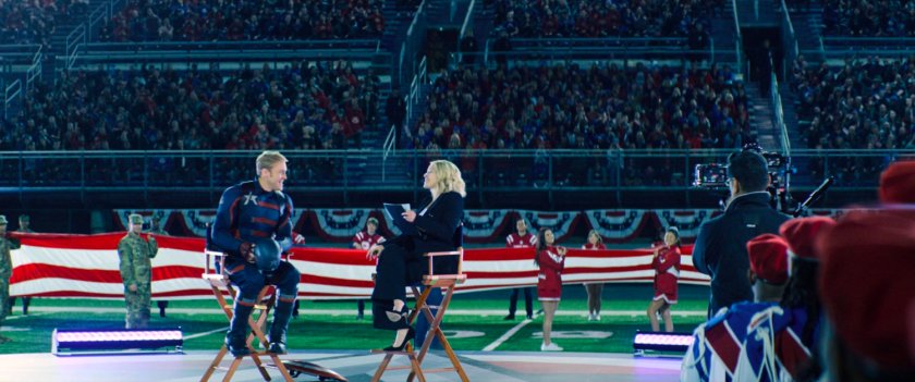 John Walker interviewed by Sara Haines on a football field.