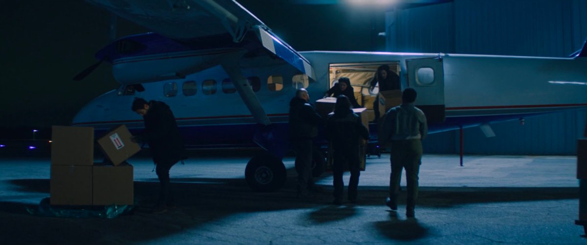 The Flag Smashers loading supplies on a plane.
