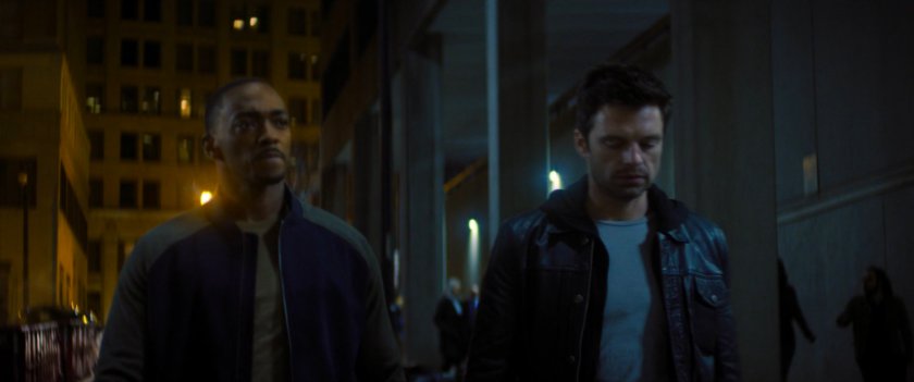 Sam and Bucky on a Baltimore street at night.