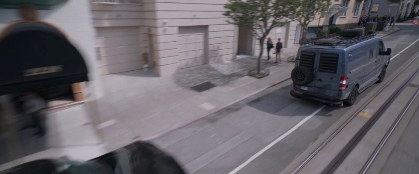 SUV chasing van on San Francisco street.