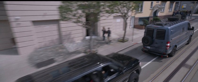 SUV chasing van on San Francisco street.