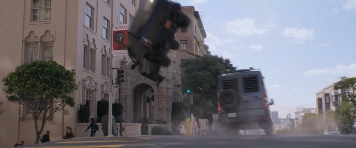 Van flips SUV on San Francisco street.