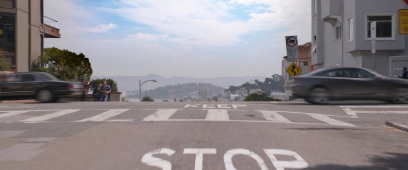 POV of van driving through intersection onto Lombard Street.