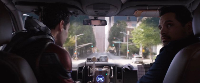 Scott and Luis inside the van looking out front window.