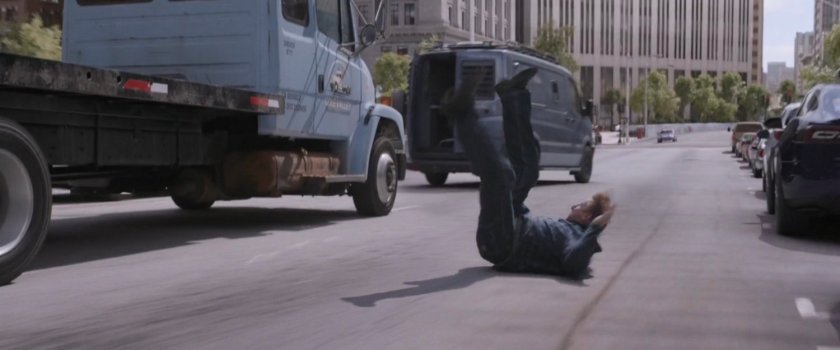 Driver is ejected from flatbed truck as it continues to chase van.