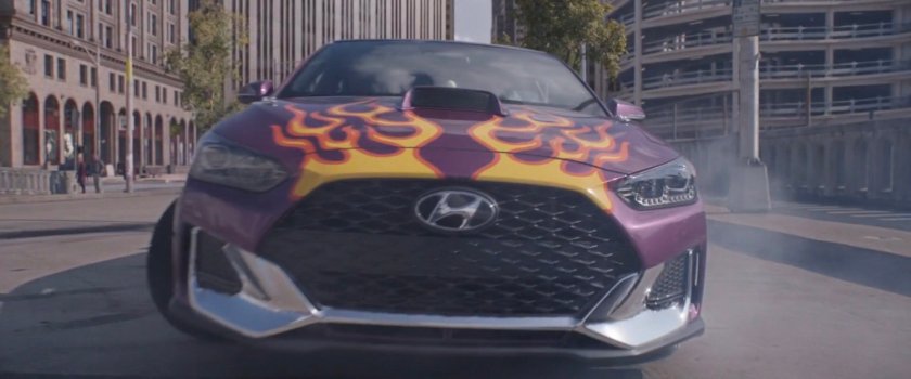 Purple Veloster pointing towards camera.