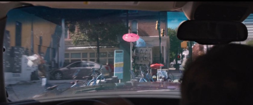 POV from inside SUV as it crashes into parked bicycles.