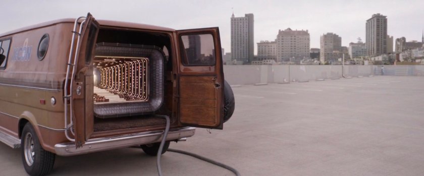 The quantum tunnel van parked on a parking garage roof.