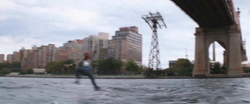 Spider-Man swinging under the Queensboro Bridge.