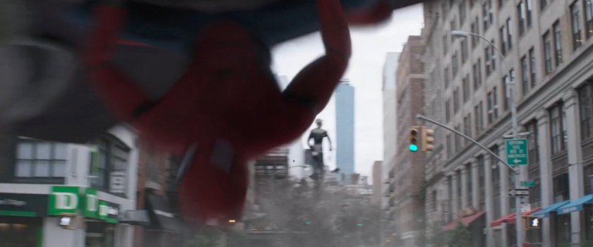 Spider-Man dodging debris thrown by Ebony Maw.