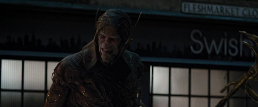 Corvus Glaive on a dark street.