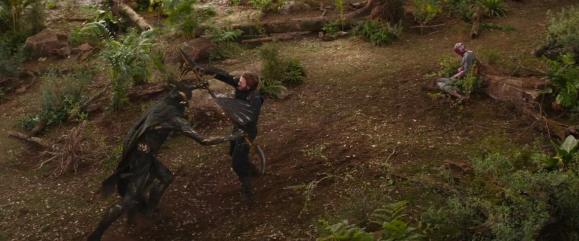 Captain America fighting Corvus Glaive in a forest.