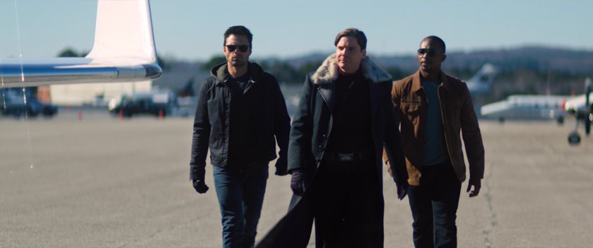 Zemo, Sam, and Bucky at an airport.