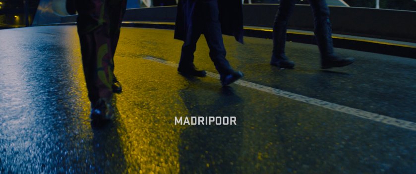 Sam, Bucky, and Zemo on Bridge. Text: Madripoor.