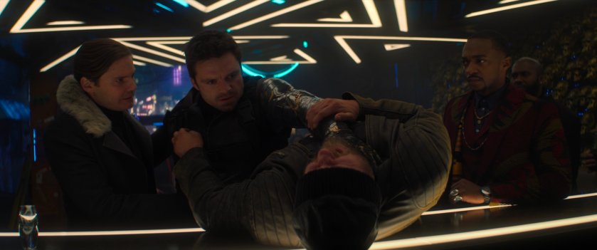 Zemo, Bucky, and Sam inside of the Brass Monkey bar.