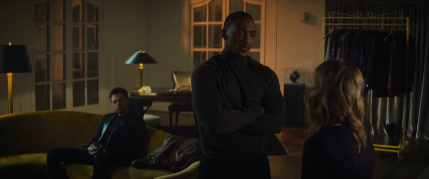 Sam talks to Sharon inside of Sharon's apartment.