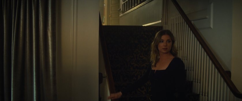 Sharon in a stairway of her aprtment.