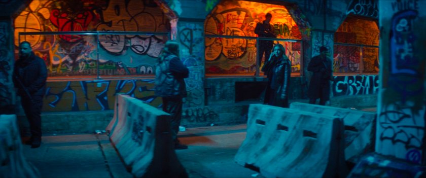 Sharon walking through a graffiti painted tunnel in Madripoor.