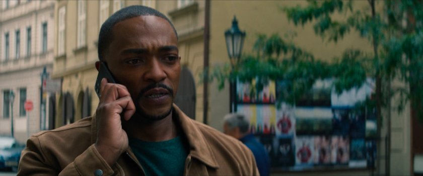 Sam on the phone on a Latvian street.