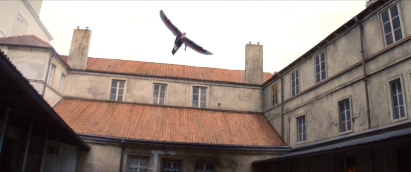 The Falcon flying above a Latvian courtyard.