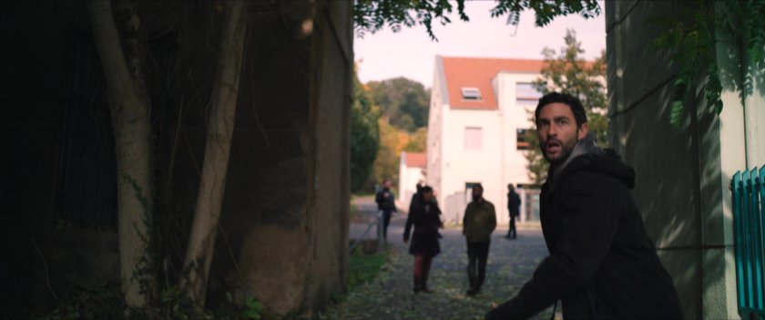 Man running outside of Flag Smasher headquarters.