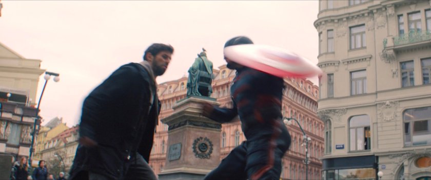 John Walker swings his shield at Nico in the courtyard.