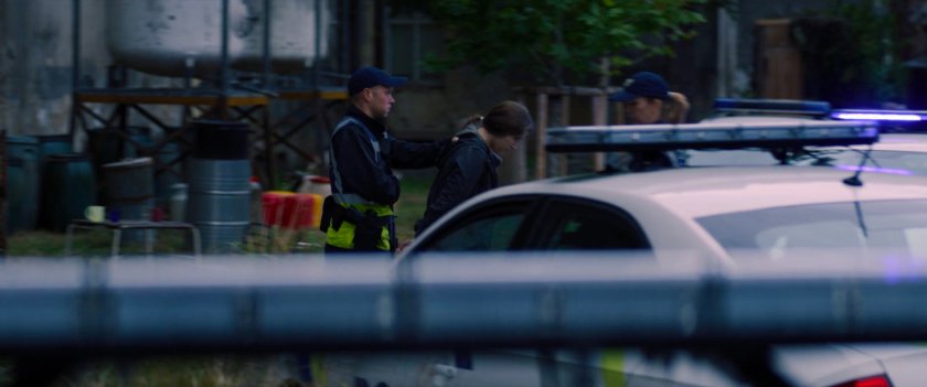 Police cars gathered outside the Flag Smasher camp.