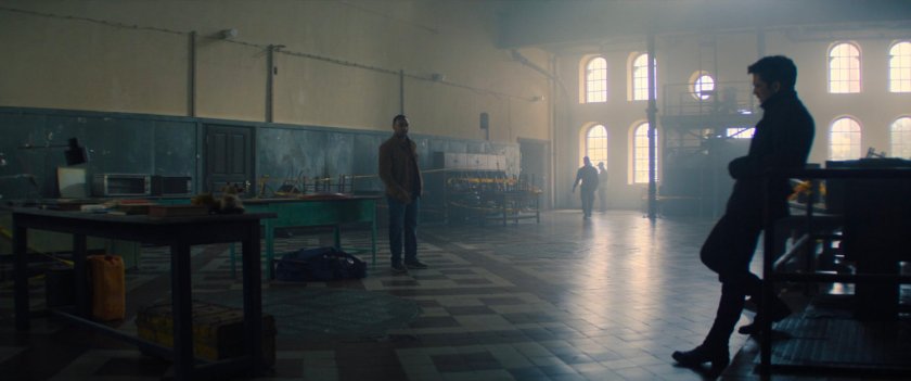 Sam and Bucky inside the Flag Smasher camp building.