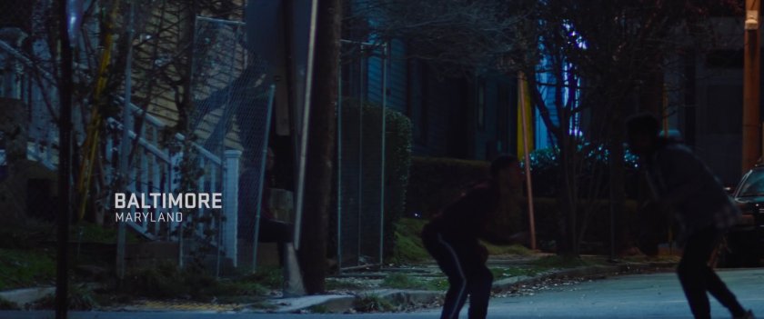 The street outside Isaiah Bradley's house at night. Text: Baltimore, Maryland.