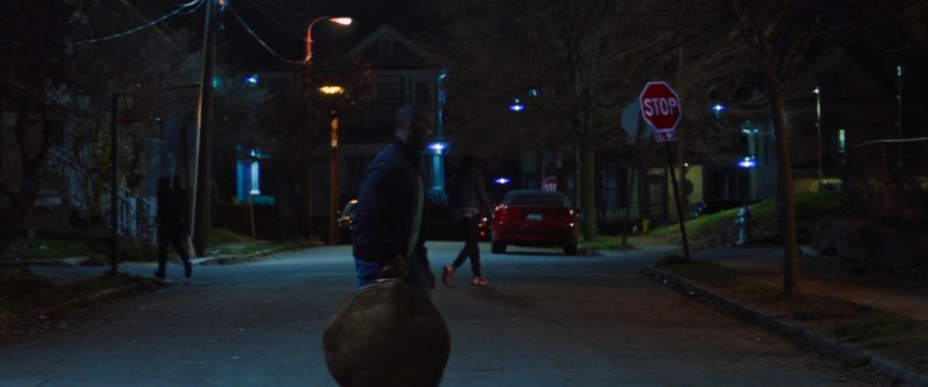 The street outside Isaiah Bradley's house at night.