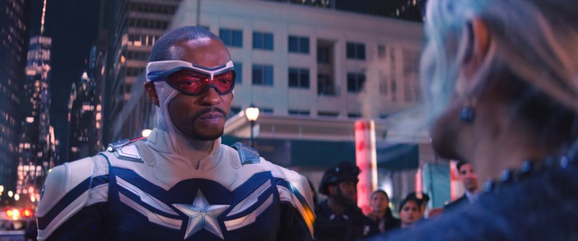 Sam Wilson stands before a number of emergency service personnel on a New York street.