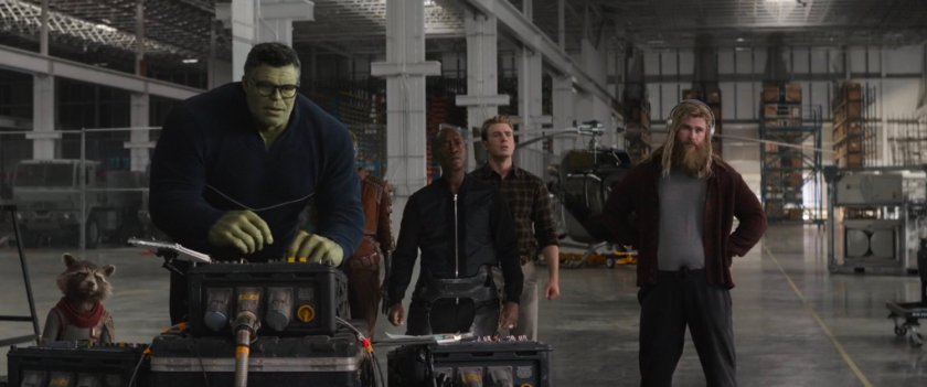 Interior of Avengers Facility warehouse with team.