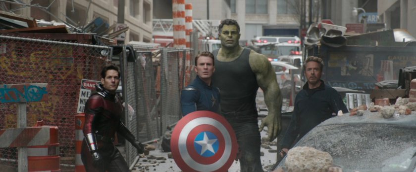 Scott, Steve, Smart Hulk, and Tony stand in a A rubble strewn alley in New York.