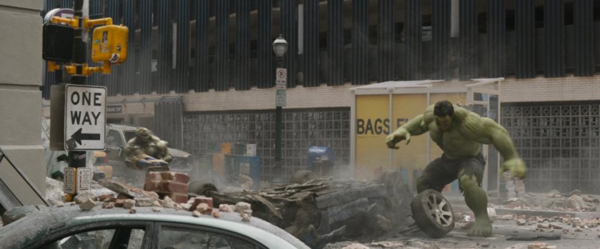 The Hulk fights Chitauri in a rubble strewn street in New York.