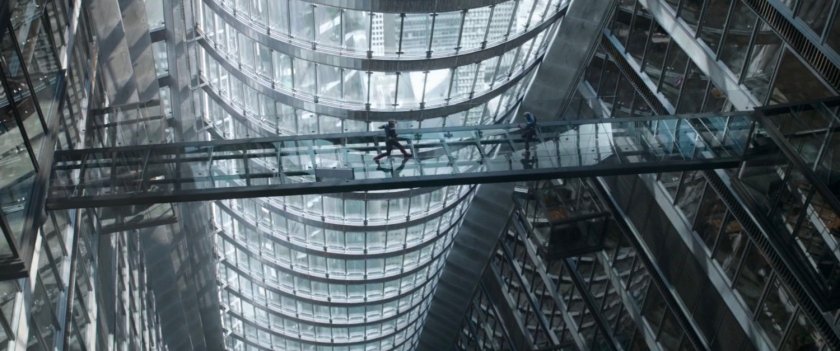 Captain Americas on a glass bridge on the 14th floor of Stark Tower.