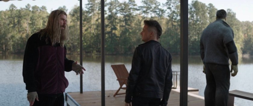 Thor, Clint, and Hulk on a dock on the river.