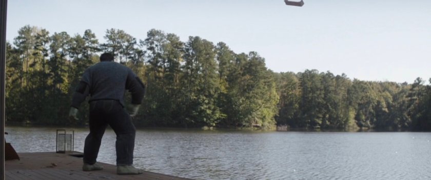 Hulk on a dock on the river.