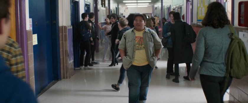 Ned approaches Peter in an interior hallway of Midtown High.