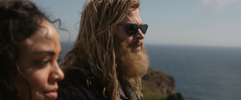 Valkyrie and Thor look down from atop a hill.