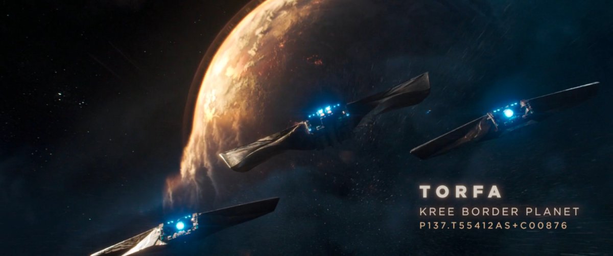 Three spaceships fly towards planet Torfa. Text: Torfa Kree Border Planet.
