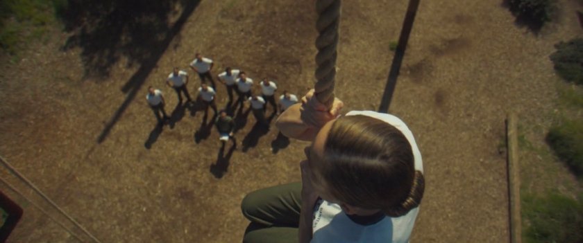 Carol Danvers on a ropes course above other cadets.
