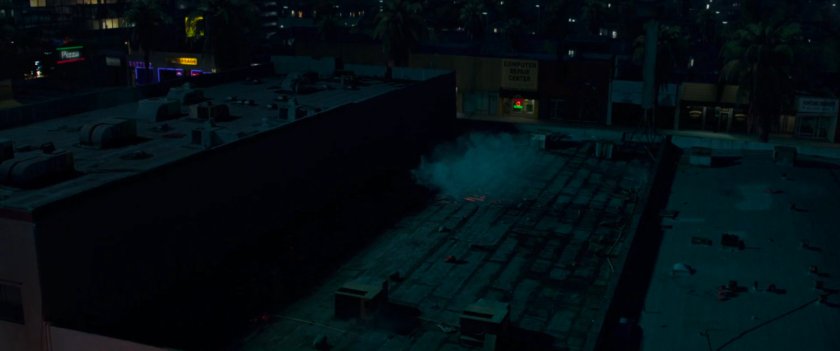 Aerial view of Blockbuster Video and street.