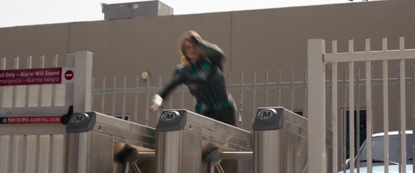 Vers leaps turnstyle at Los Angeles metro station.