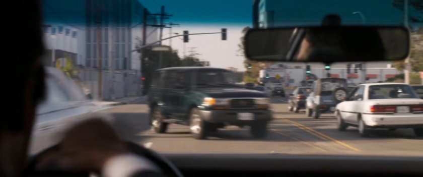 POV of oncoming cars swerving to avoid speeding car.