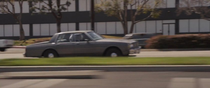 Nick Fury's car racing down Los Angeles street.